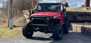 Red Jeep with lift kits installed