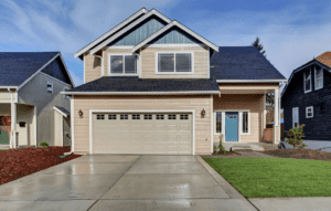 image of a 3 bedroom house with a clean driveway and garage for how to house hack any property blog