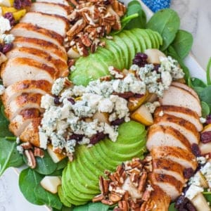 chicken spinach salad with pears, cheese and avocado