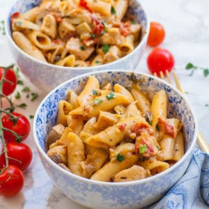 creamy sun-dried tomato and chicken pasta in small bowls