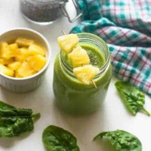 smoothie with leaves around it