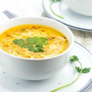 soup in a white soup on a side dish