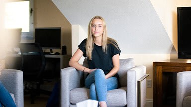 Teen girl sitting in chair