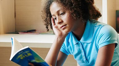 Teen girl reading book