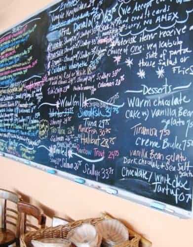 the daily menu and specials on the chalkboard at Scales & Shells