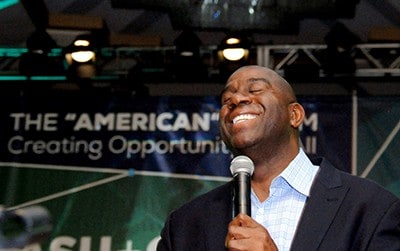 Baltimore convention photographers with Magic Johnson Magic Johnson address a Baltimore convention about his foundation.