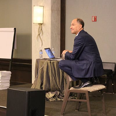 Bill Presenting on a chair