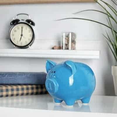 Cute piggy bank on table indoors. Stylish interior