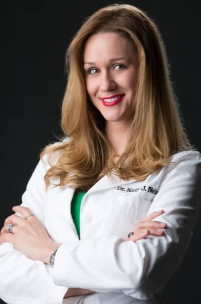 Dr. Katy Nelson in a white lab coat