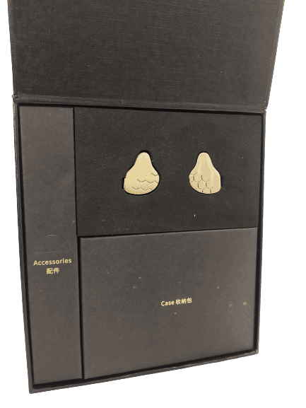 Image shows the black internal packaging. The image shows the earphones neatly positioned to the top area.