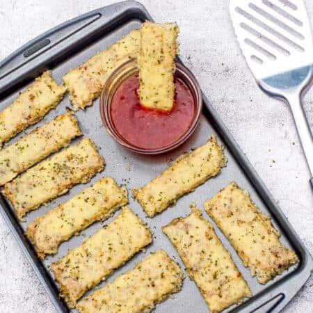 tray of breadsticks with spatula