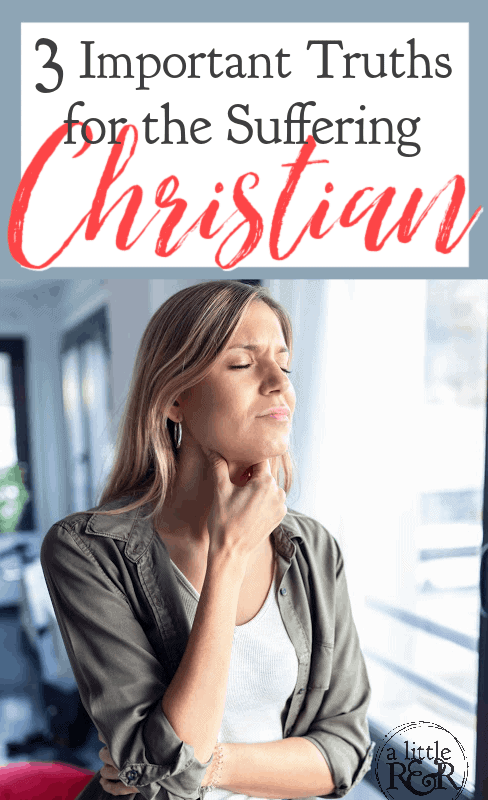 Woman standing by window in pain