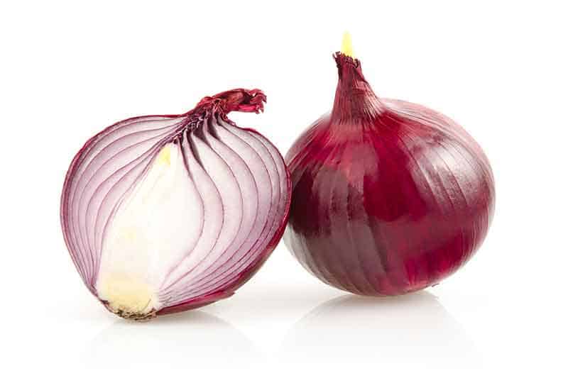 photo of a red onion cut in half