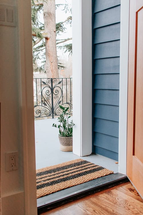 DIY Doormat tutorial - Make an inexpensive and custom striped or monogrammed doormat with just a few materials. Perfect for all seasons!