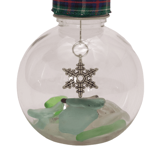 Image shows a close up view of the snowflake charm and the sea glass.