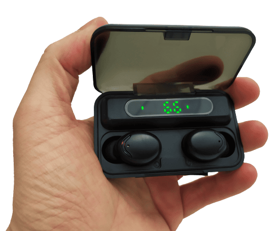 Image shows the earphones inside the charging box. I'm holding the case with my left hand.