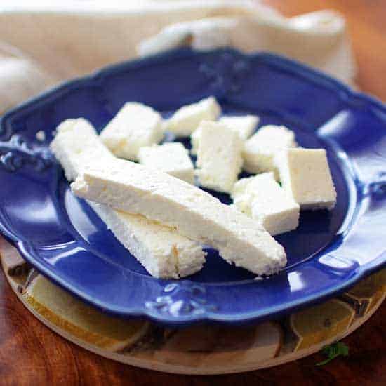 Sliced paneer on a small plate