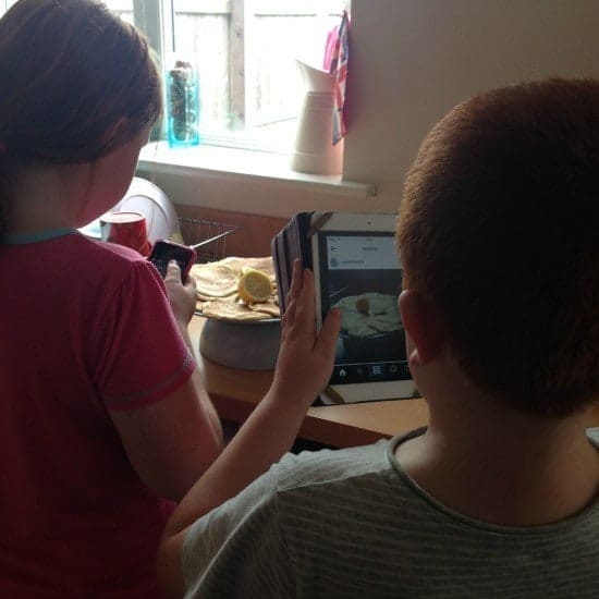 Budding Instagrammers taking a photo of their pancakes before eating them!