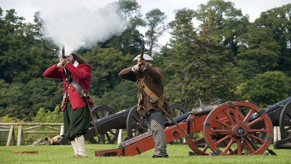 Red coats act out the battle of the boyne