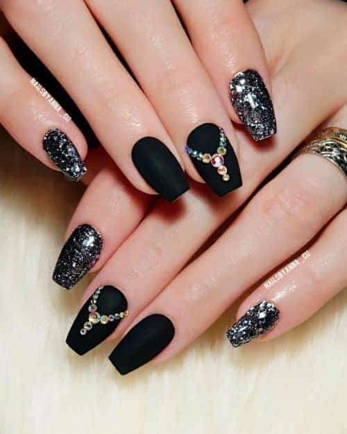 Amazing matte black coffin nails with rhinestones and two silver glitter nails