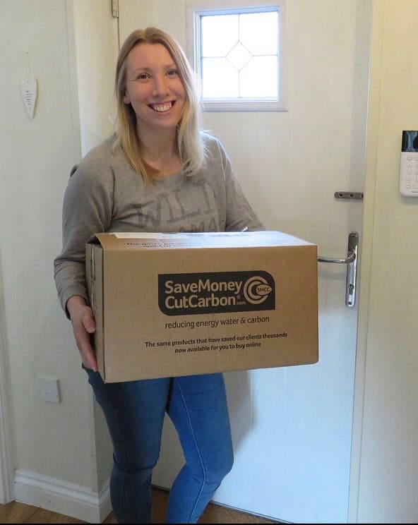 me in my hallway holding my box from save money cut carbon