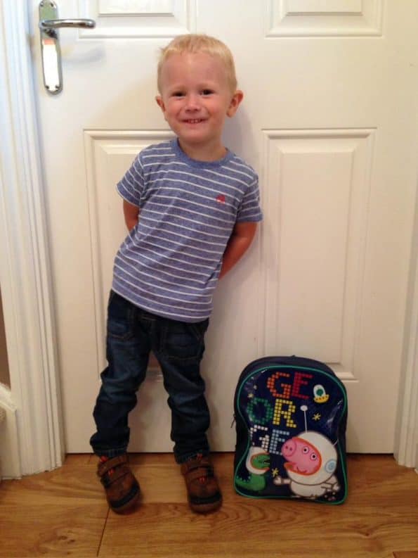 Jake stood by a door with his backpack
