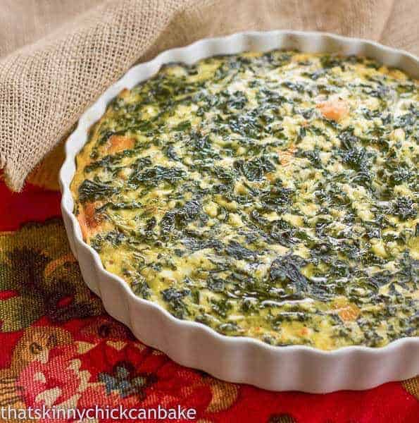 Spinach Souffle - An easy, cheesy side dish! Spinach Souffle in a white ceramic baking dish