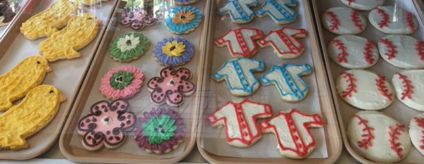 Sugar cookies look like yellow chicks, spring flowers, baseballs and baseball jerseys in the window at Schneider's Bakery in Cooperstown.