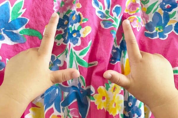Making an "L" with the left thumb and index finger Making an "L" with the left thumb and index finger