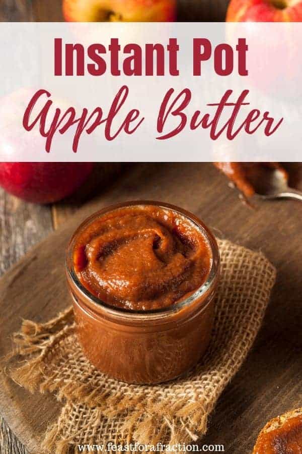 cutting board with burlap napkin with jar of apple butter and spoon