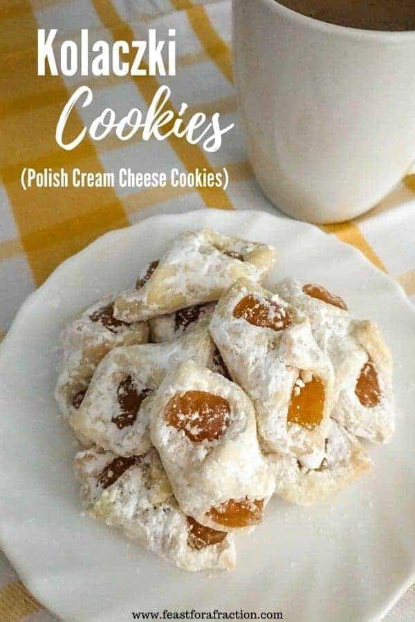 apricot kolaczki cookies on white plate on yellow and white towel