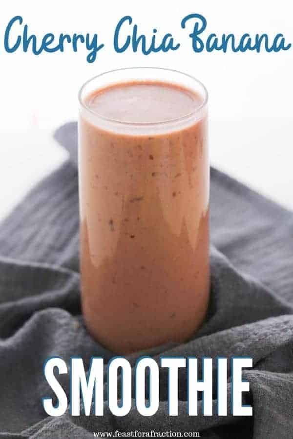 Cherry Banana smoothie in glass cup with gray cloth napkin on white surface with title text "Cherry Chia Banana Smoothie"