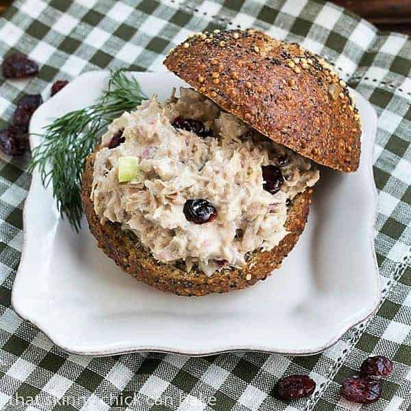 Tuna, Cranberry, Pecan Salad Sandwich - a quick lunch recipe for a delicious change of pace! Tuna, Cranberry, Pecan Salad Sandwich on a white plate