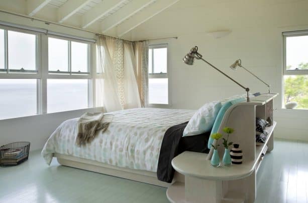 warm grey guest room with turquoise accents