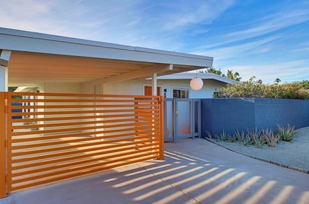 an attached carport completed with a gate for extra protection and privacy