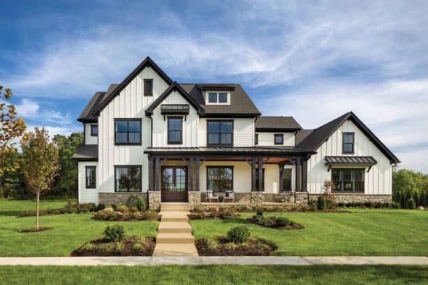 cream white exterior with brown roof and black trim