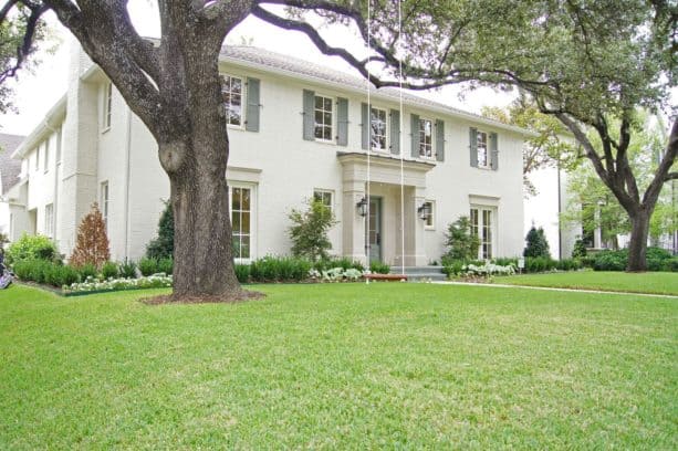 painted brick house exterior with white and grey color scheme