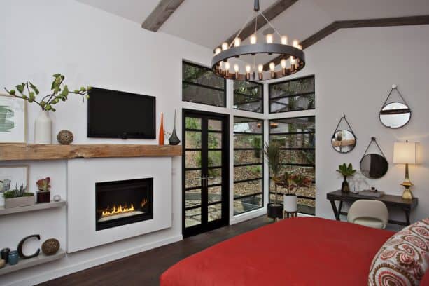 bedroom with light gray walls and scarlet red bedding set