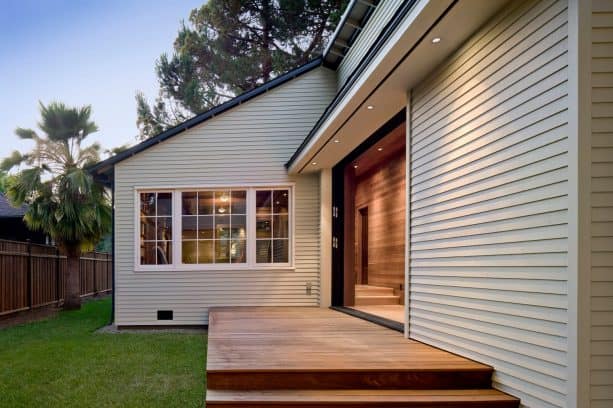 a light, warm grey house with clear-stained deck