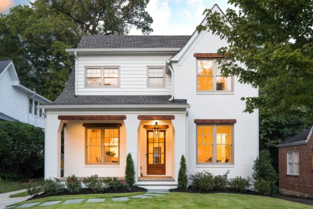 a cozy atmosphere from the combination of pastel white painted brick and warm grey windows