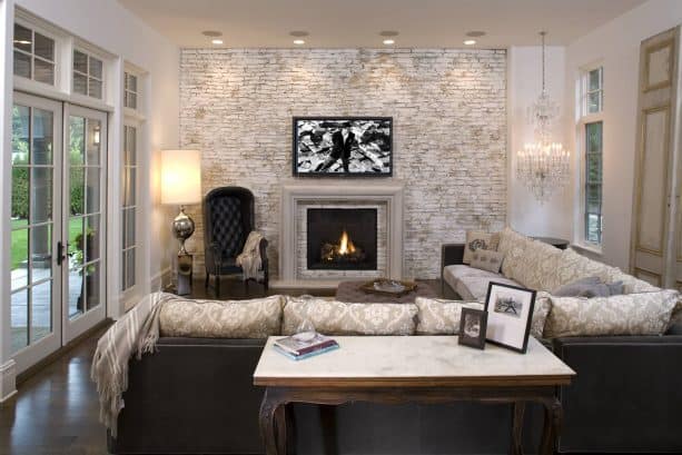 chic living room design with white and gray-washed accent brick wall