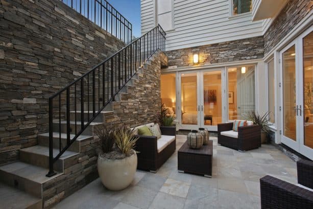 an outdoor living area on a walkout basement patio