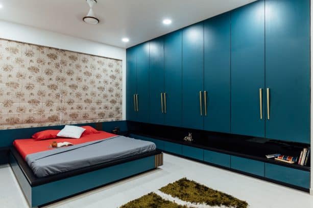 an Asian-style bedroom with fascinating custom teal and black furniture pieces