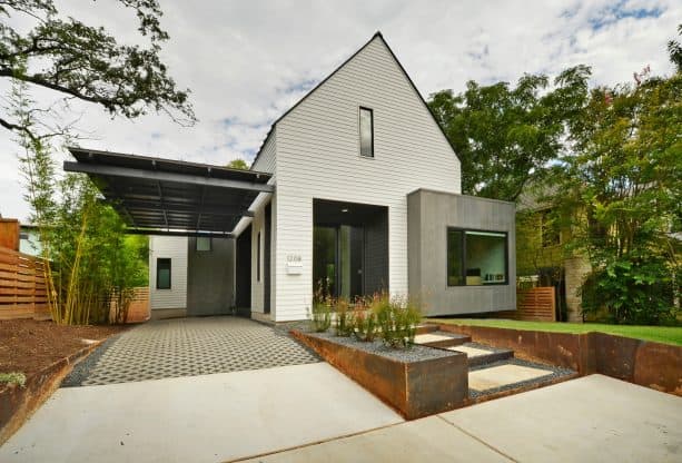 a minimalist black attached carport in floating design