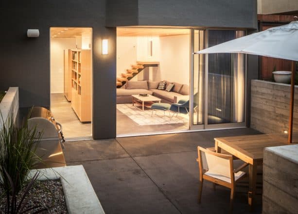 a modern concrete walkout basement patio at backyard