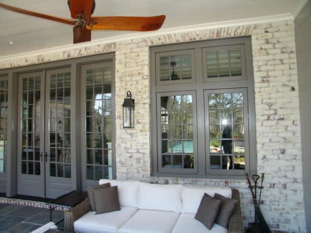 traditional porch with lime-washed brick wall