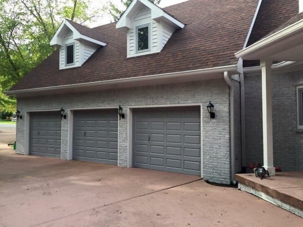 home exterior look with color-washed grayish brick walls and fossil gray doors