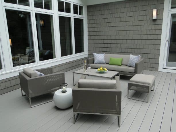 a dark grey shingle siding paired with a light grey deck