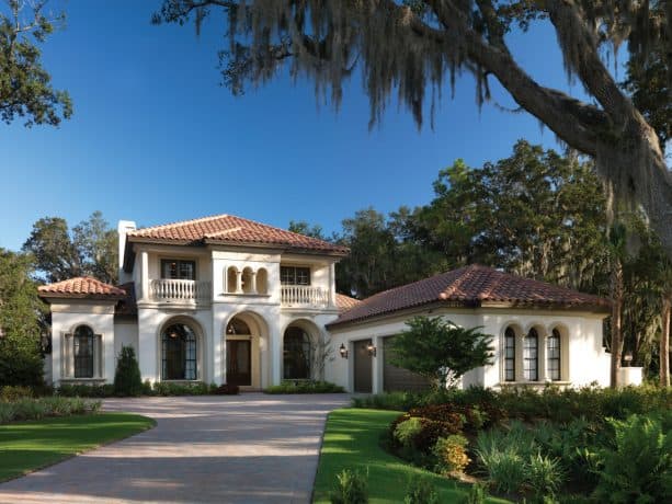 ivory white mountain home with clay roof shingles