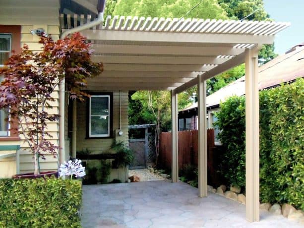an aesthetic attached carport with pergola-style detail on each edge